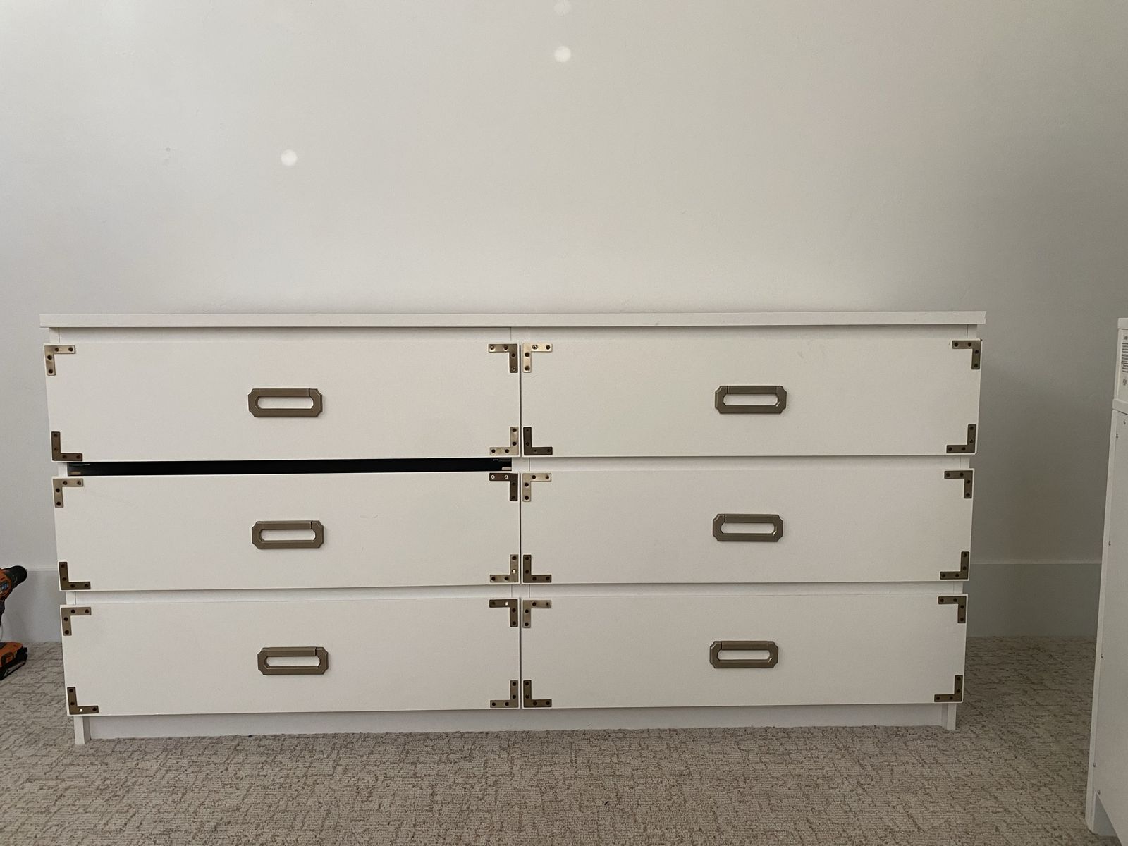 White 6-Drawer Dresser with Brass Corner Brackets and Pull Handles
