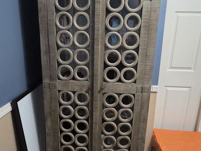 Rustic Gray Wooden Storage Cabinet with Decorative Circle Cutout Doors