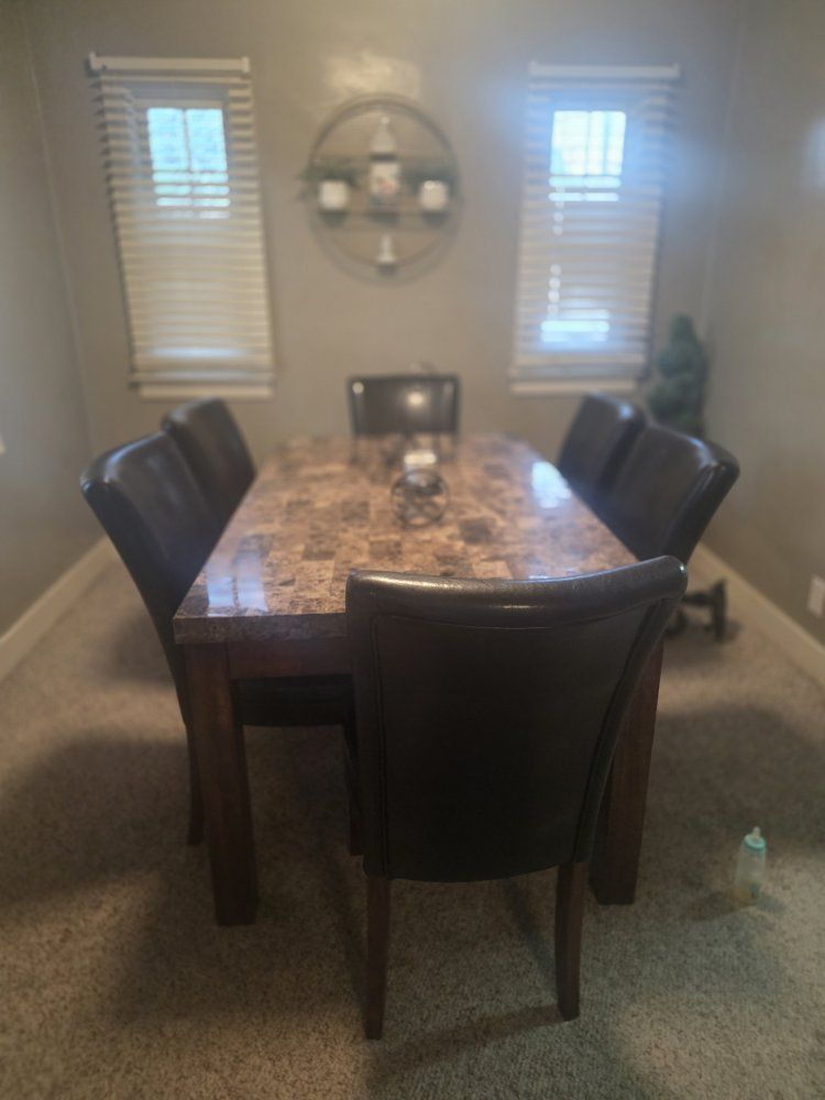 Large Marble Top Dining Table with 6 Black Leather Chairs - Spacious Seating, Elegant Design