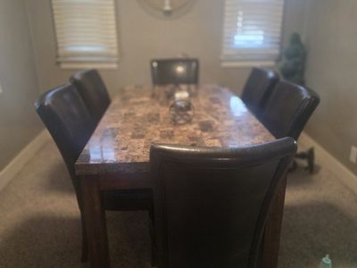 Large Marble Top Dining Table with 6 Black Leather Chairs - Spacious Seating, Elegant Design
