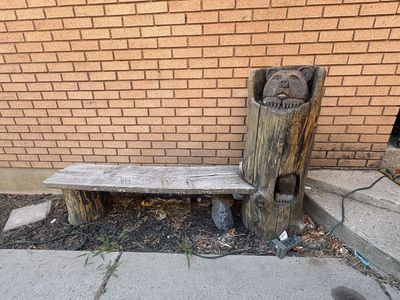 Wooden bench with bear