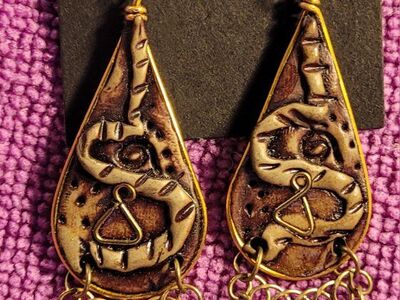 Vintage pair of artisan gold-tone dangle earrings