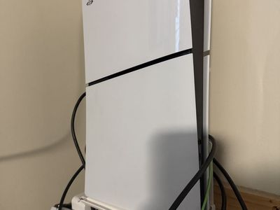 PlayStation 5 with controller and headset.