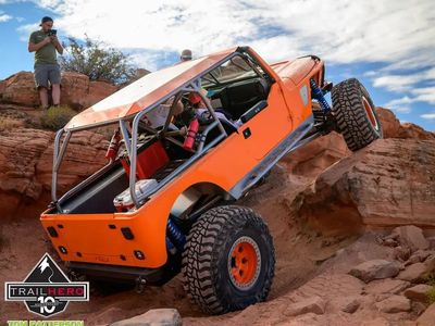Custom Orange Gen-Right Off Road Rock Crawler Jeep Built for Extreme Trail Performance