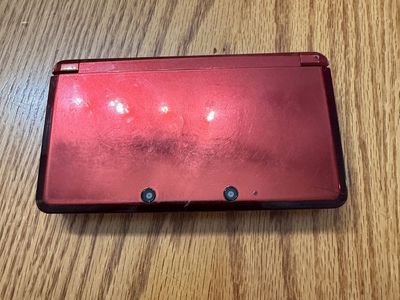 Red Nintendo 3DS with 4 Pokémon games