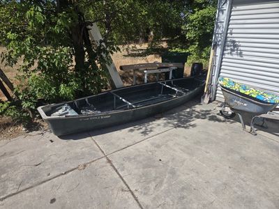Used RAM-X Scanoe 15' Fiberglass Canoe/Boat - Durable, Green, Ready for Water