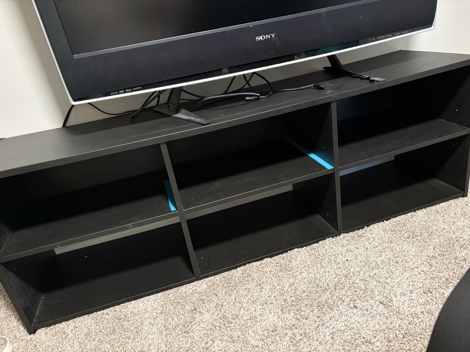 Black 6 foot shelf /entertainment center.