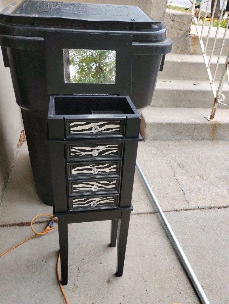 Black Standing Jewelry Armoire with Zebra Print Drawers and Mirror