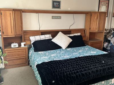 King bed frame w/attached side tables.