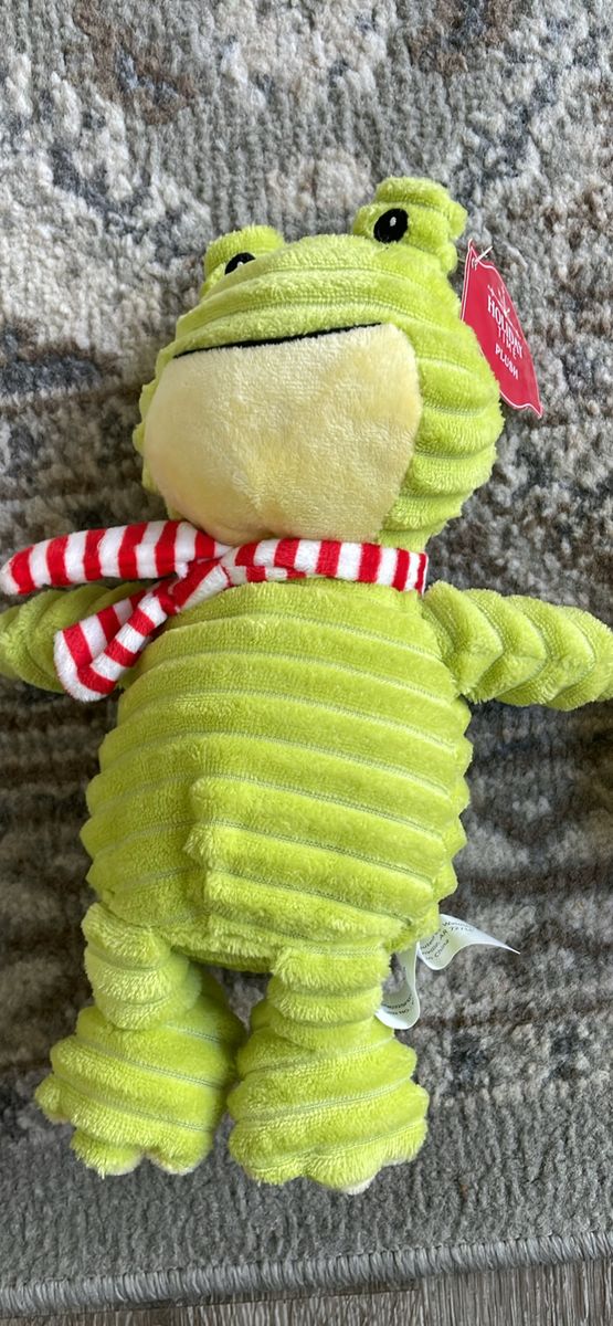 Holiday Time corduroy frog Christmas plush toy featuring a green ribbed body and a red and white striped scarf.