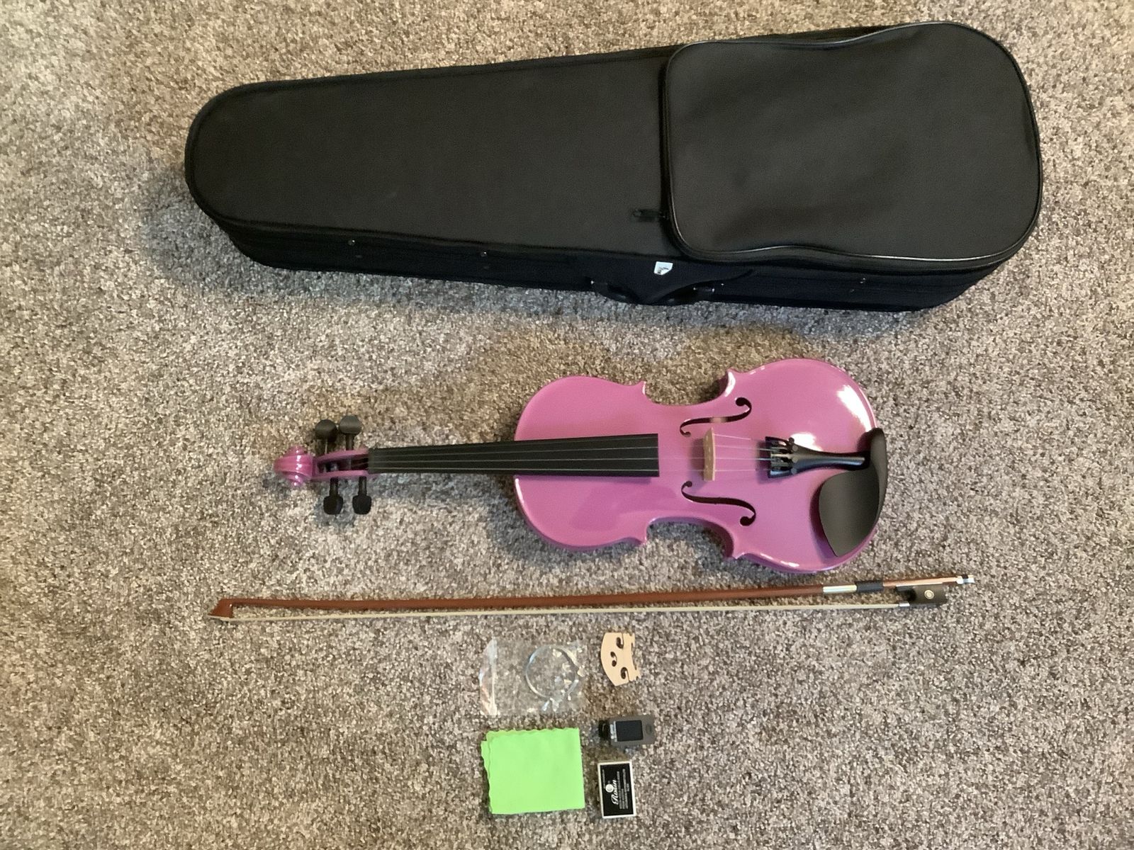 Diorrin full size purple violin with hard case, bow, and accessories. 