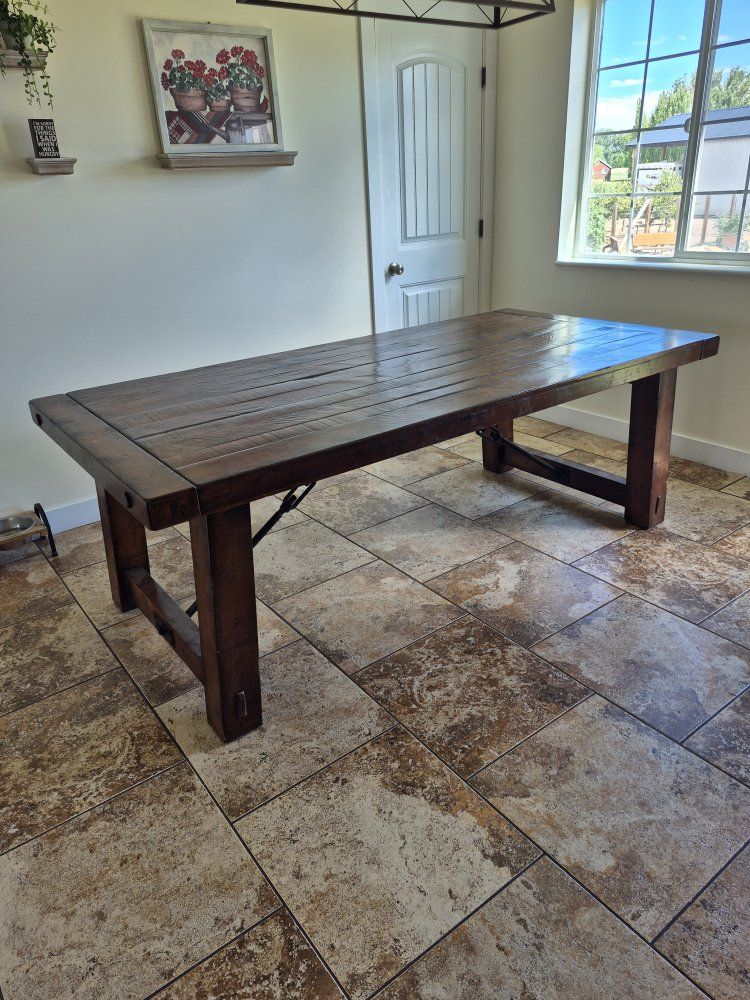 Rustic 7'-2" x 42" with two 18" leafs.
Solid wood construction with metal accents