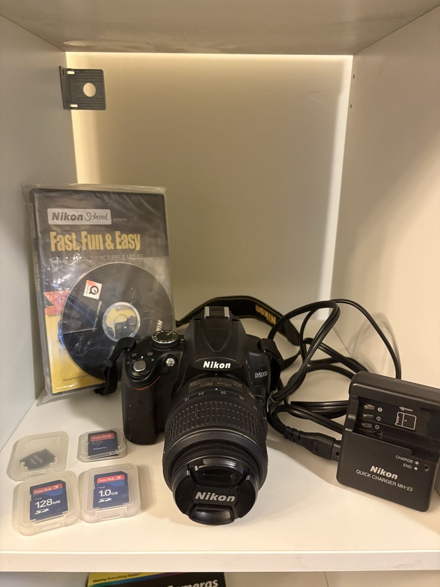 Nikon D5000 DSLR Camera with 18-55mm Lens, Charger, bag, and SD Cards