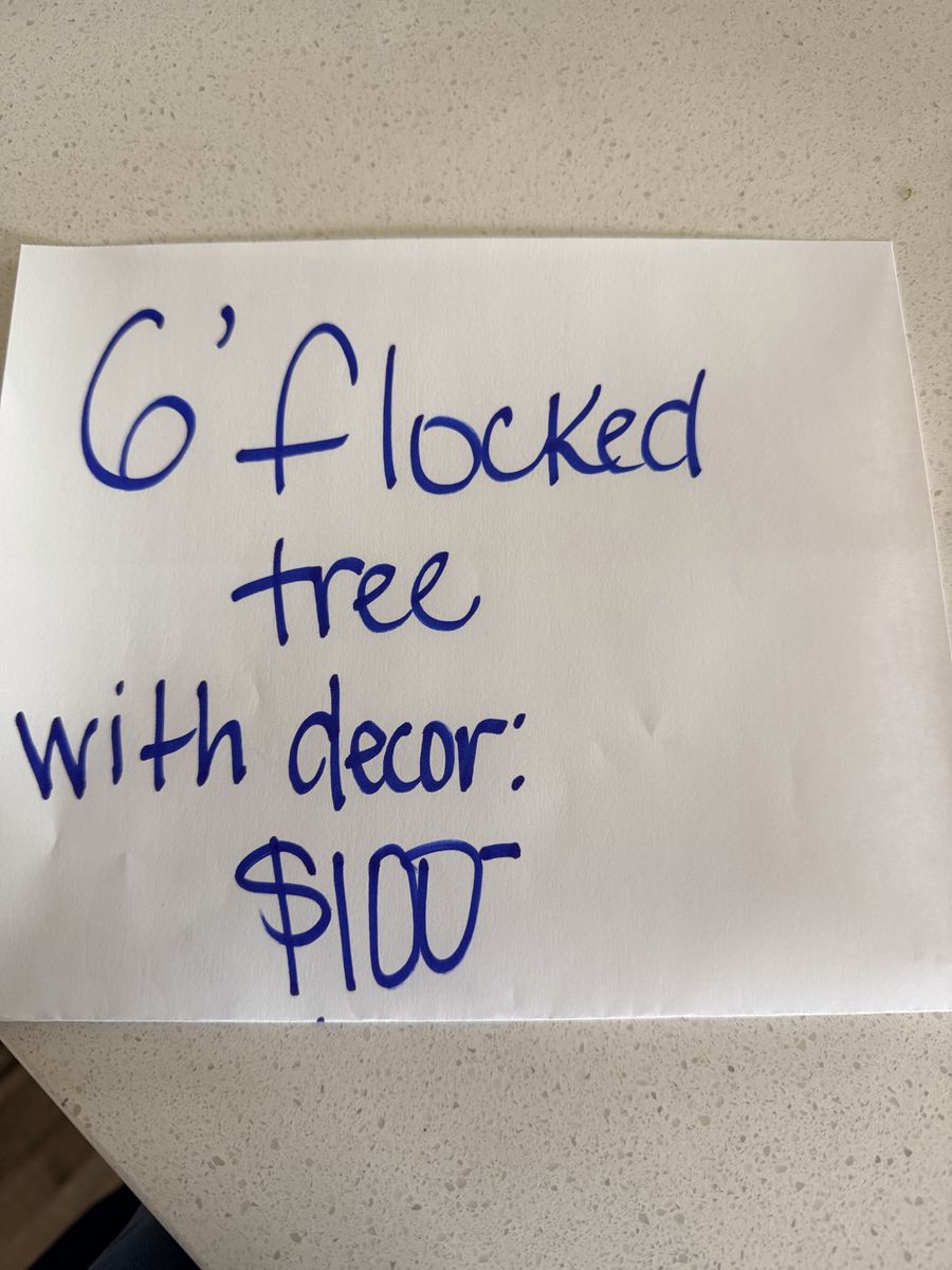 6’ flocked Christmas tree with decorations