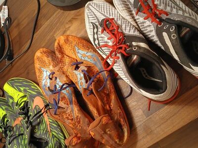 multiple running shoes with spikes for track and