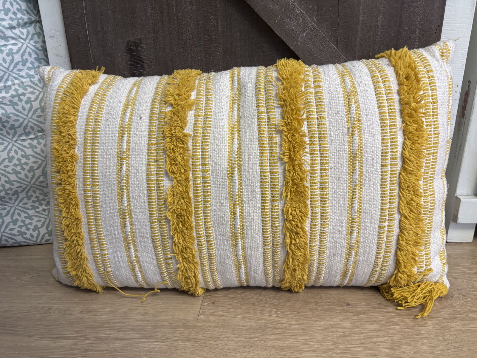 Yellow striped accent pillow
