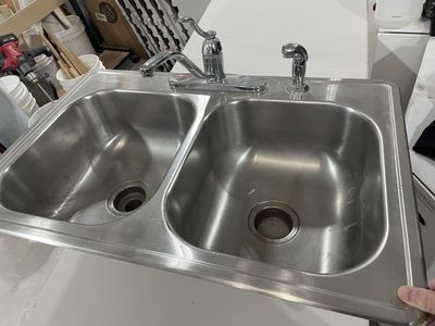 Stainless steel sink with faucet