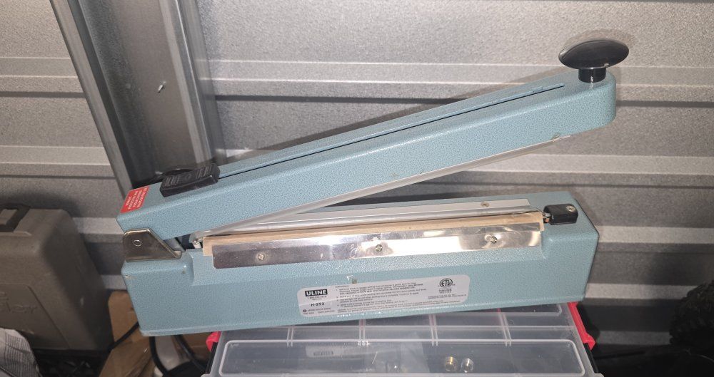 Uline 12" Tabletop Impulse Sealer - Packaging for Various Materials WITH roll of side seam shrink wrap. (asking price o.b.o.)