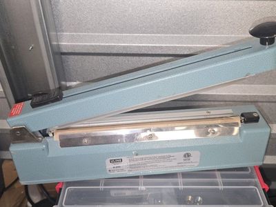 Uline 12" Tabletop Impulse Sealer - Packaging for Various Materials WITH roll of side seam shrink wrap. (asking price o.b.o.)