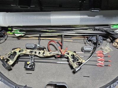 Bear Cruzer Lite Right-Hand bow and plus a dozen extra arrows plus 2 triggers and extras w target.