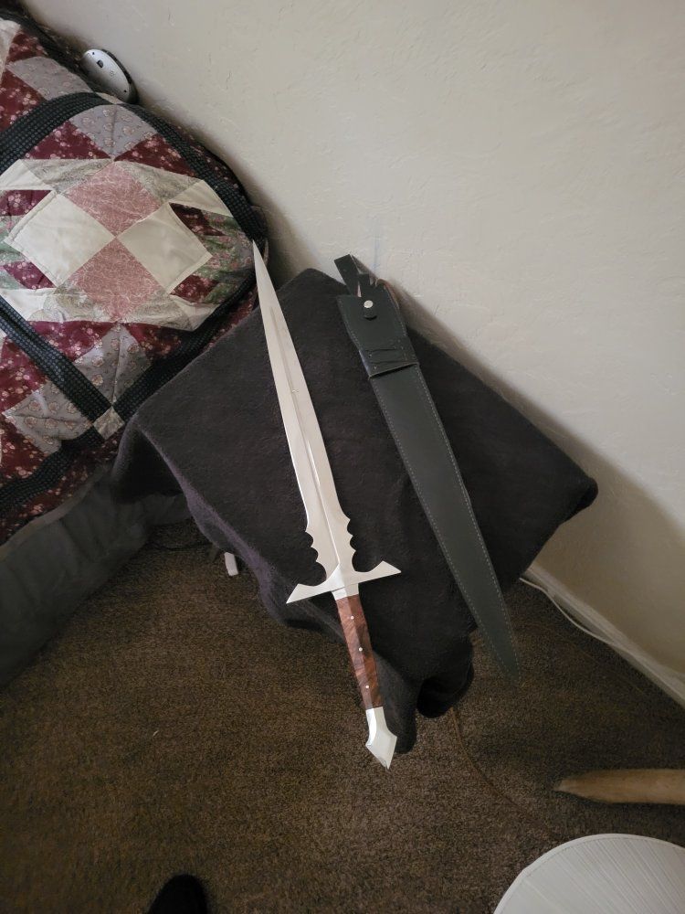 Hand Forged Carbon Steel Sword with Leather Sheath.