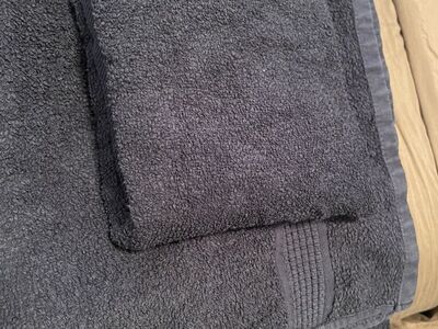 Black bath towel and black hand towel