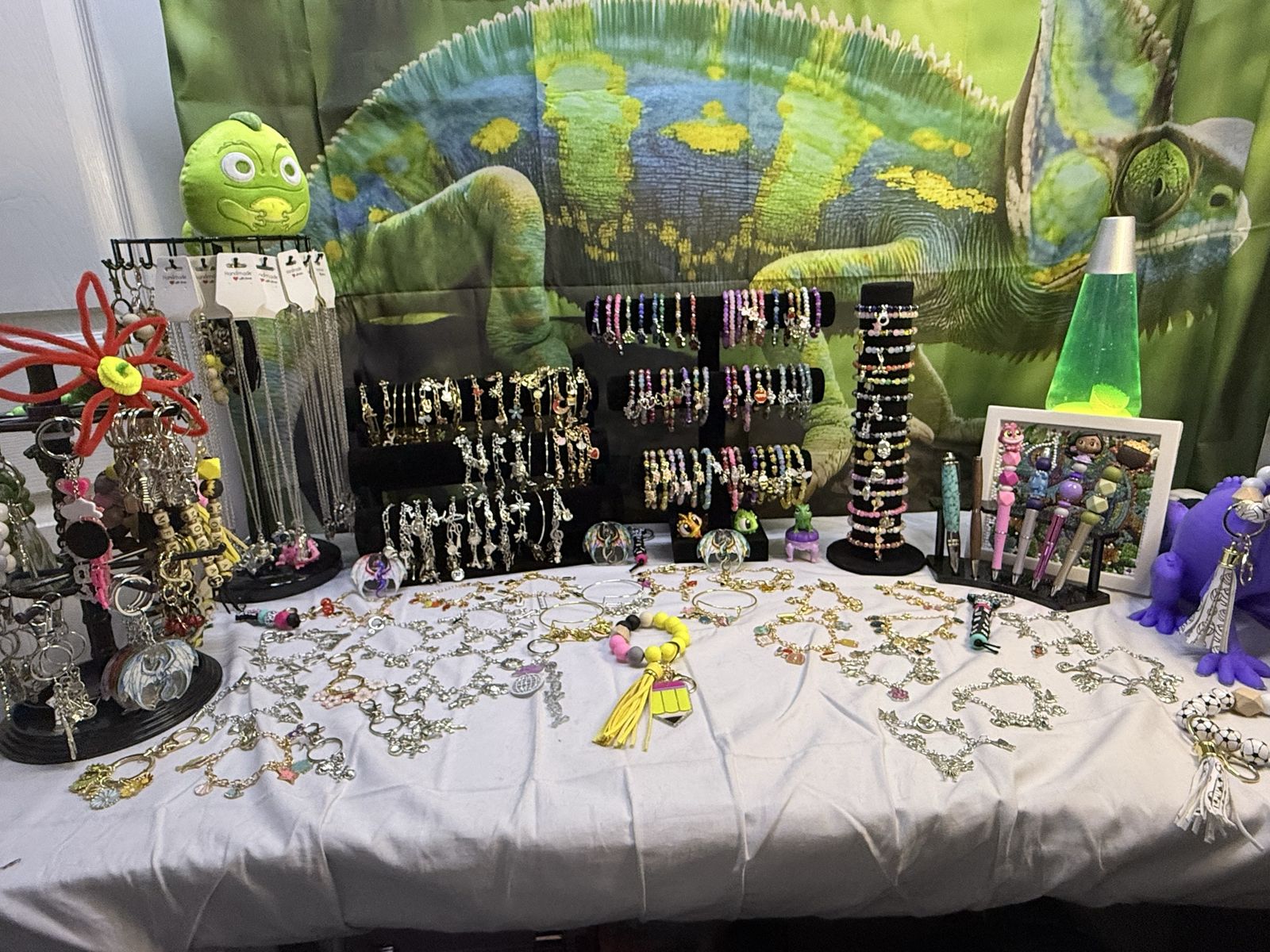 Charmed bracelets, glass bead bracelets, necklaces, keychains and pens.
