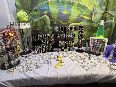 Charmed bracelets, glass bead bracelets, necklaces, keychains and pens.