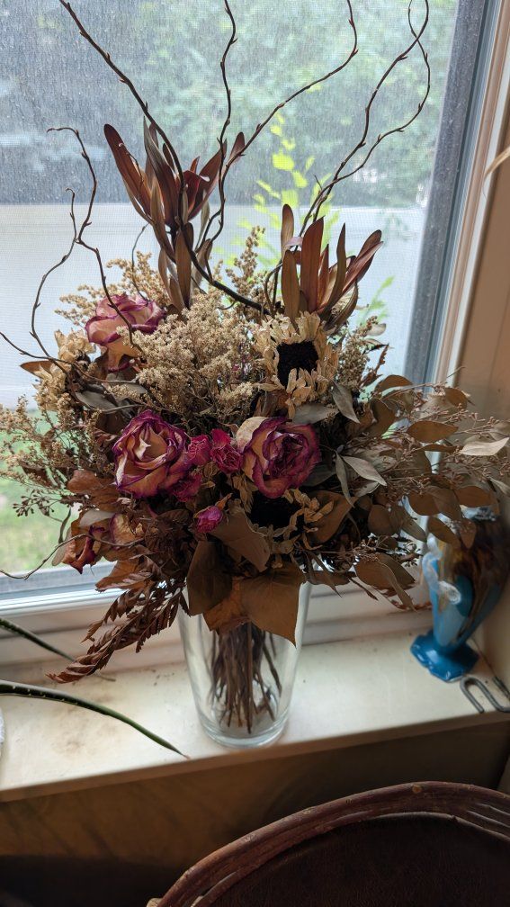 Dried Flower Arrangement with Roses and Sunflower Accents in Glass Vase