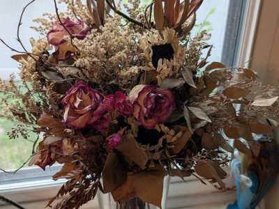 Dried Flower Arrangement with Roses and Sunflower Accents in Glass Vase