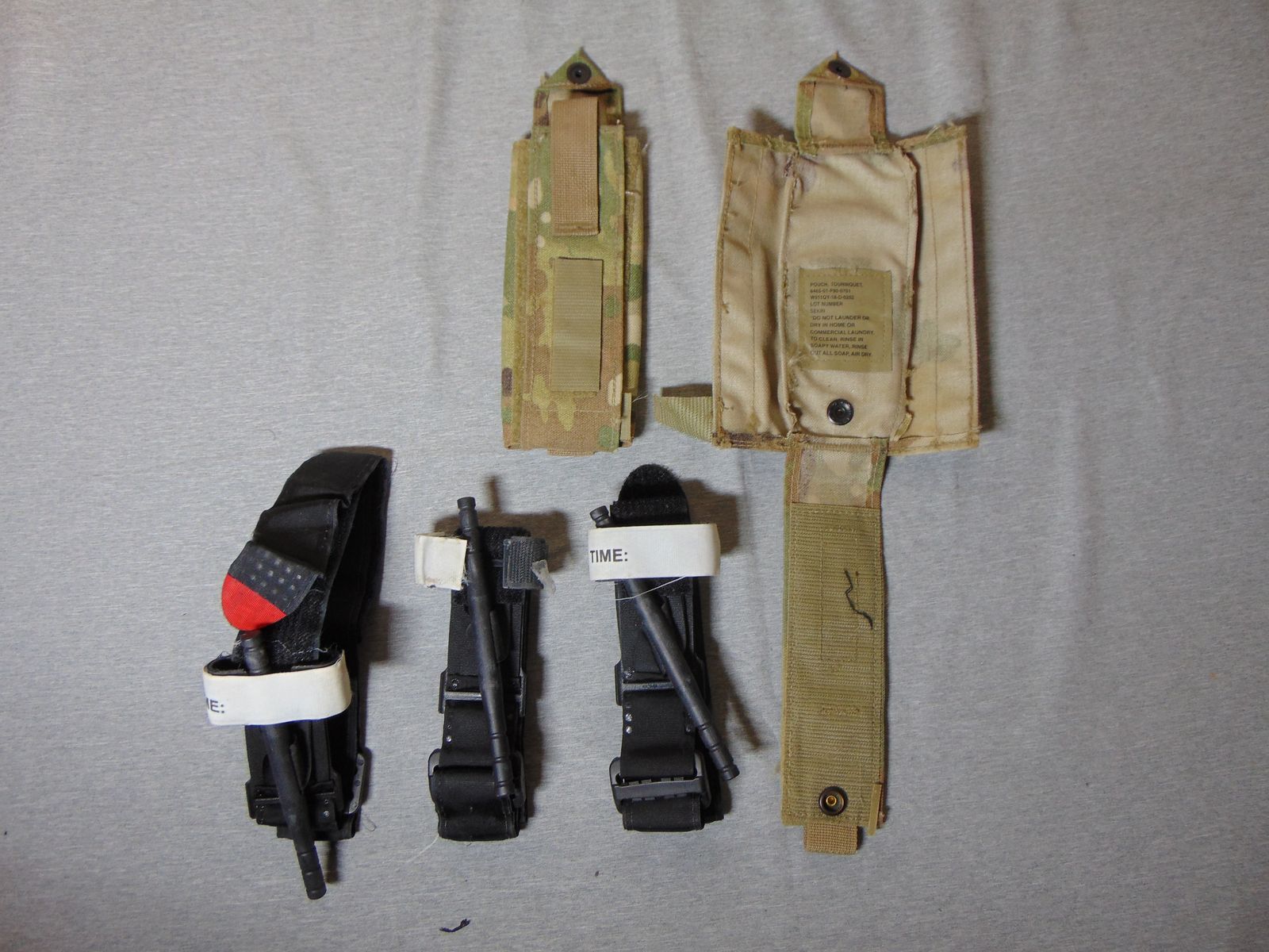 3 - NAR Gen 6 CAT Tourniquets & 2 - OCP Pouches Excellent