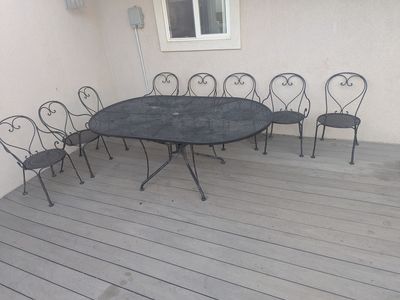 Patio Table Light with Eight Chairs and Cushions