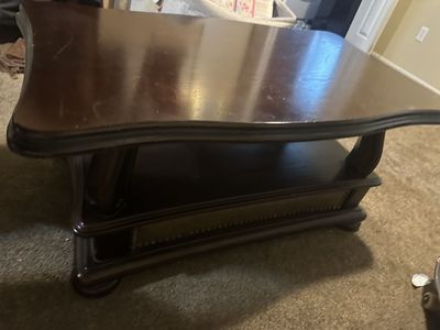 Elegant Dark Wood Coffee Table with Scalloped Edges and Lower Shelf
