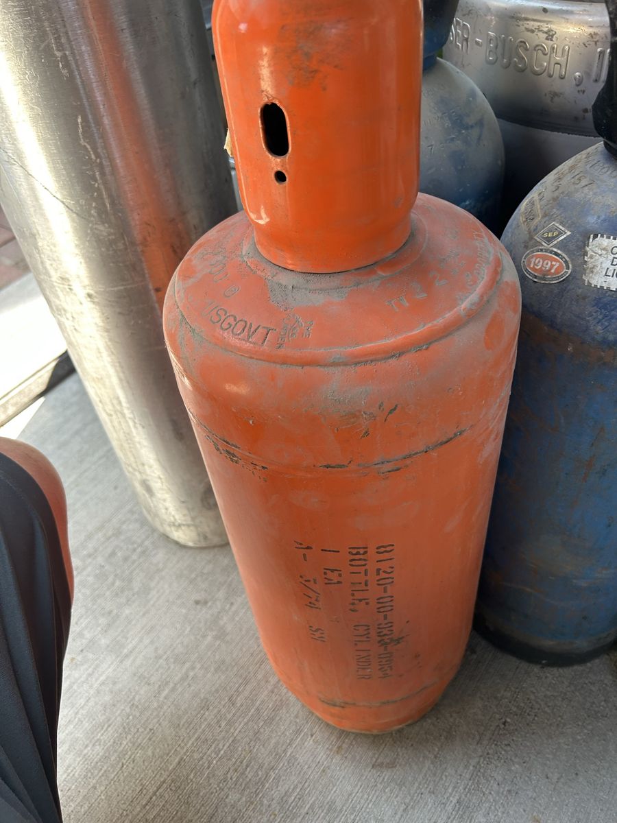 Vintage Military US Government Orange 20 Lb cylinder often used for technical, medical, or specialty gases.
