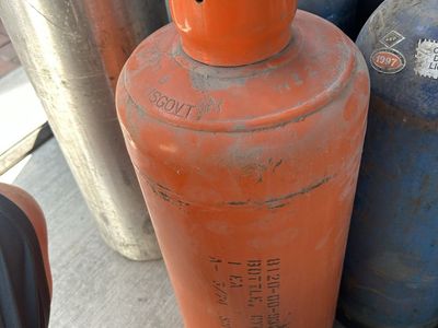Vintage Military US Government Orange 20 Lb cylinder often used for technical, medical, or specialty gases.