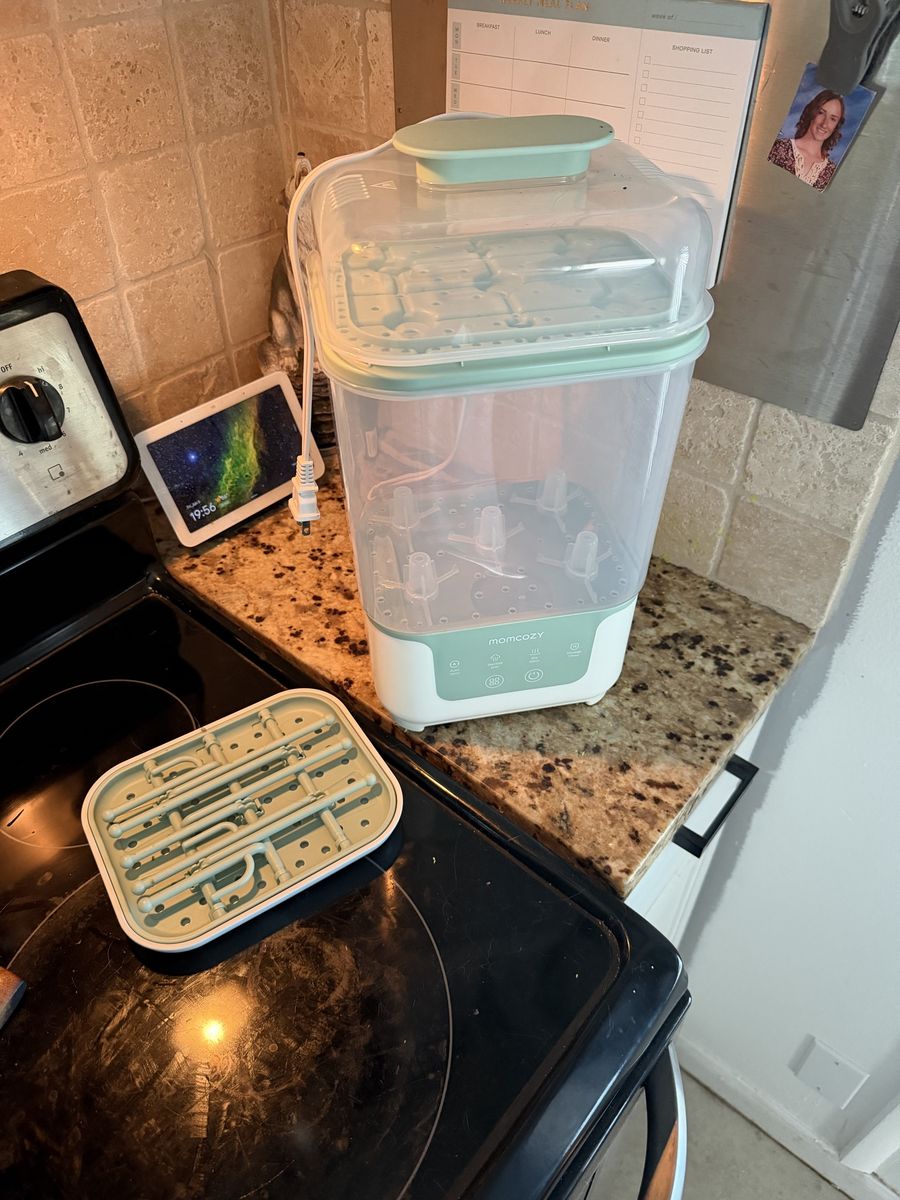 Momcozy bottle sterilizer and bottle drying wrack that matches.