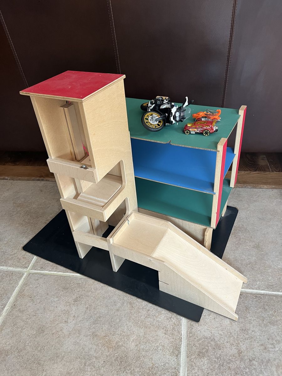 Wood kids car racer set with raceway and elevator and cars.