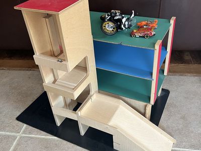 Wood kids car racer set with raceway and elevator and cars.