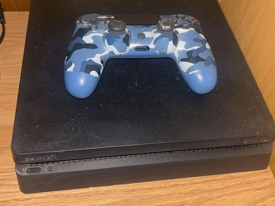 Sony PlayStation 4 Slim 1TB Console with Blue Camo Controller & 2 Games
