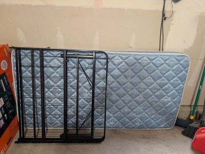 Single size cot and mattress.