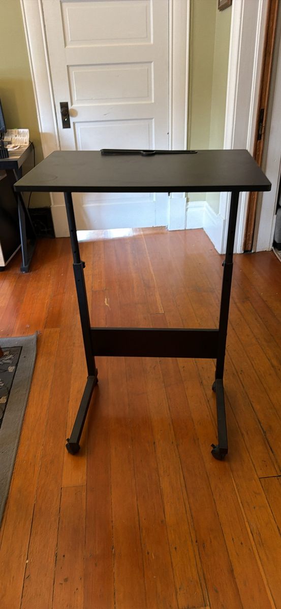 Adjustable, movable, lockable computer desk