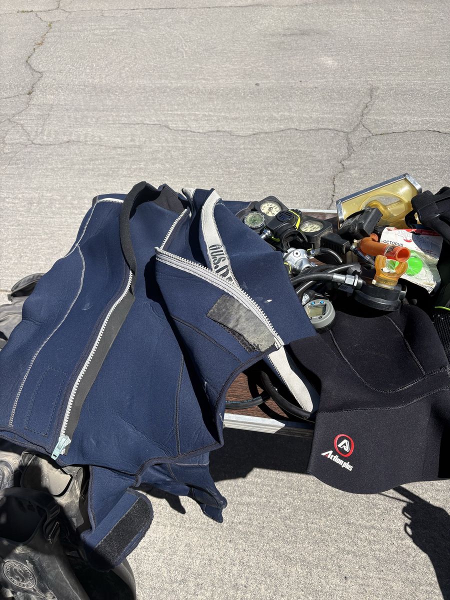 Random Assortment of Scuba Gear - Wetsuits, Flippers, and Other Accessories