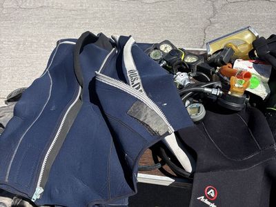 Random Assortment of Scuba Gear - Wetsuits, Flippers, and Other Accessories