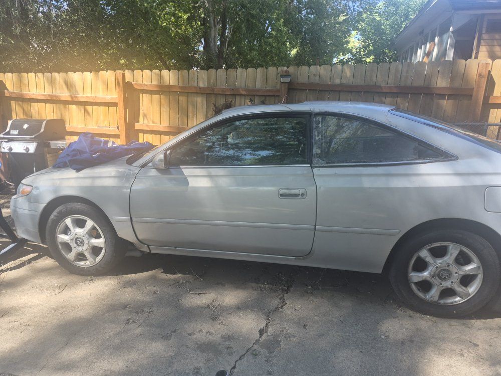 toyota solero car for sale it's a great running car it has230,000 miles and it runs so quite and doesn't have a miss or anything