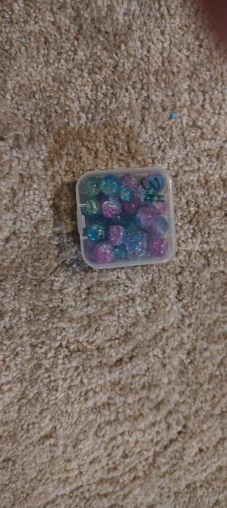 Assorted Blue and Purple Crackle Beads in Small Plastic Storage Container