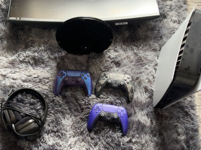 PS5 with 3 controllers, a monitor, and headset