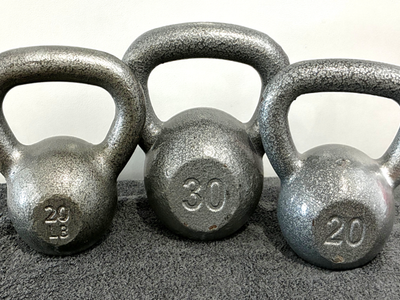 Three Cast Iron Kettle Bells