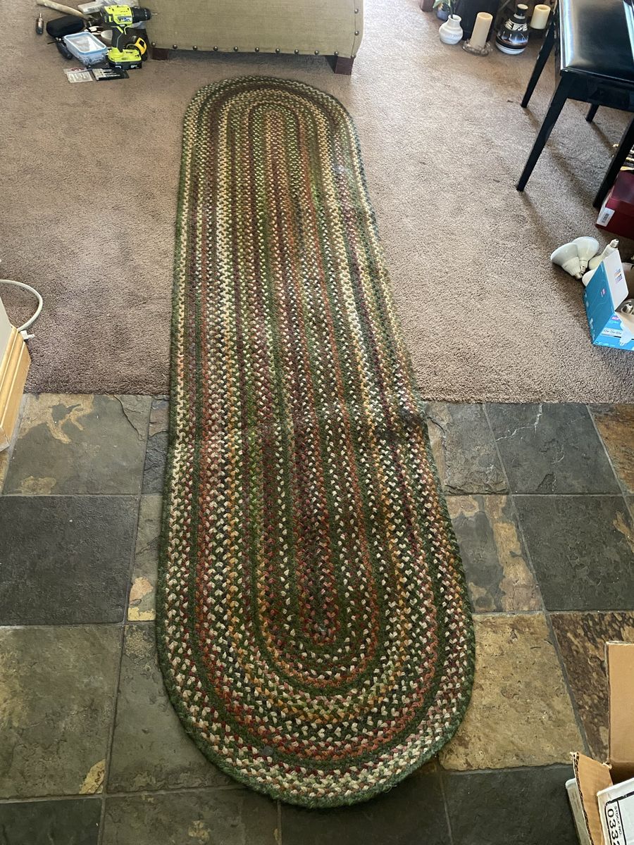 Dark green textured 2.5’x8’ braided rug