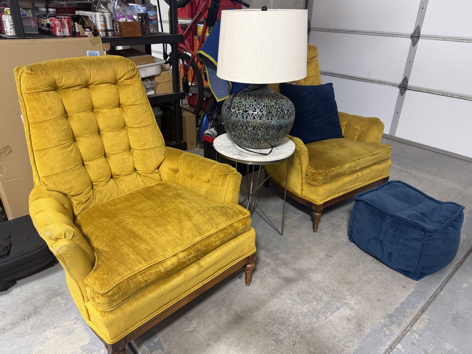 Two, used, gold color Lombard chairs from Granite Furniture + a lamp, end table, blue pillow, and blue padded footrest.