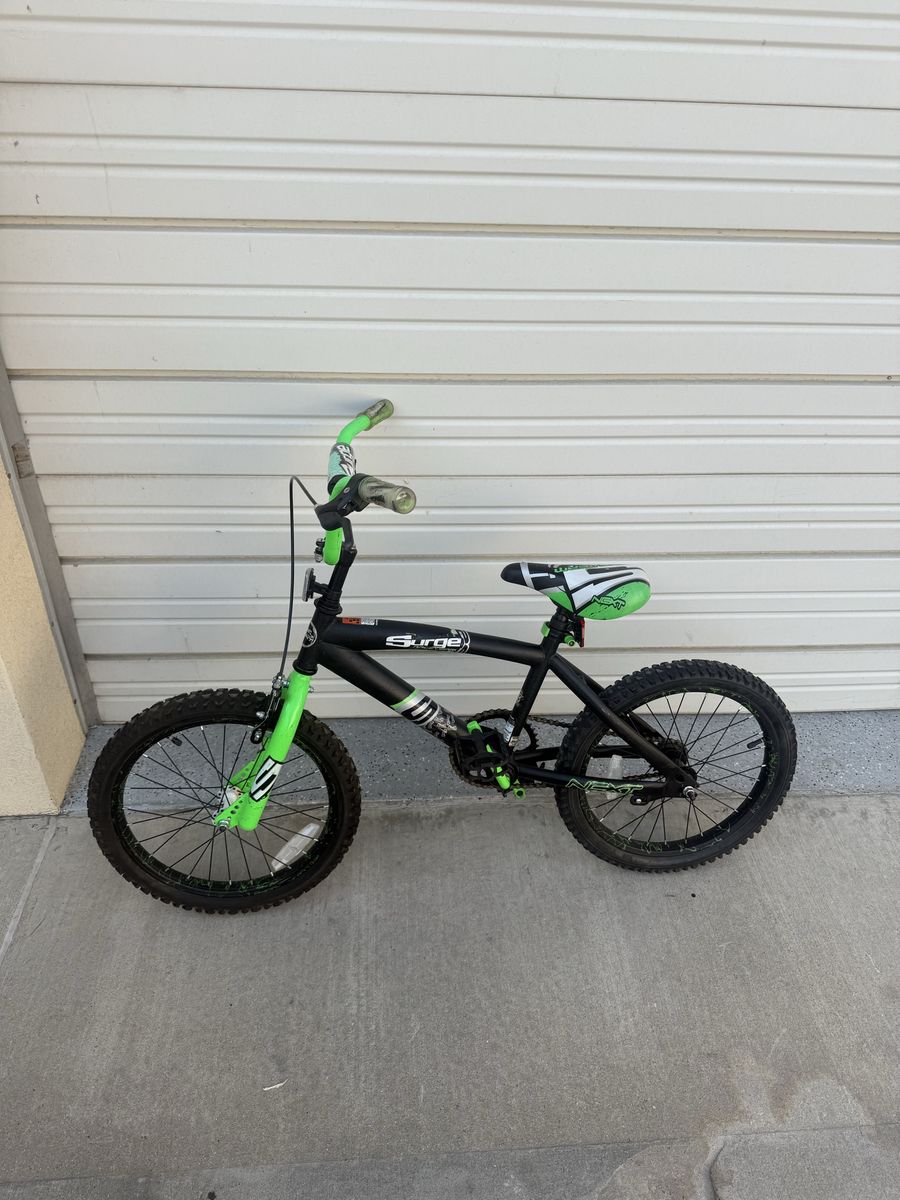 18 inch Surge BMX bike Black with green highlights. Excellent condition 